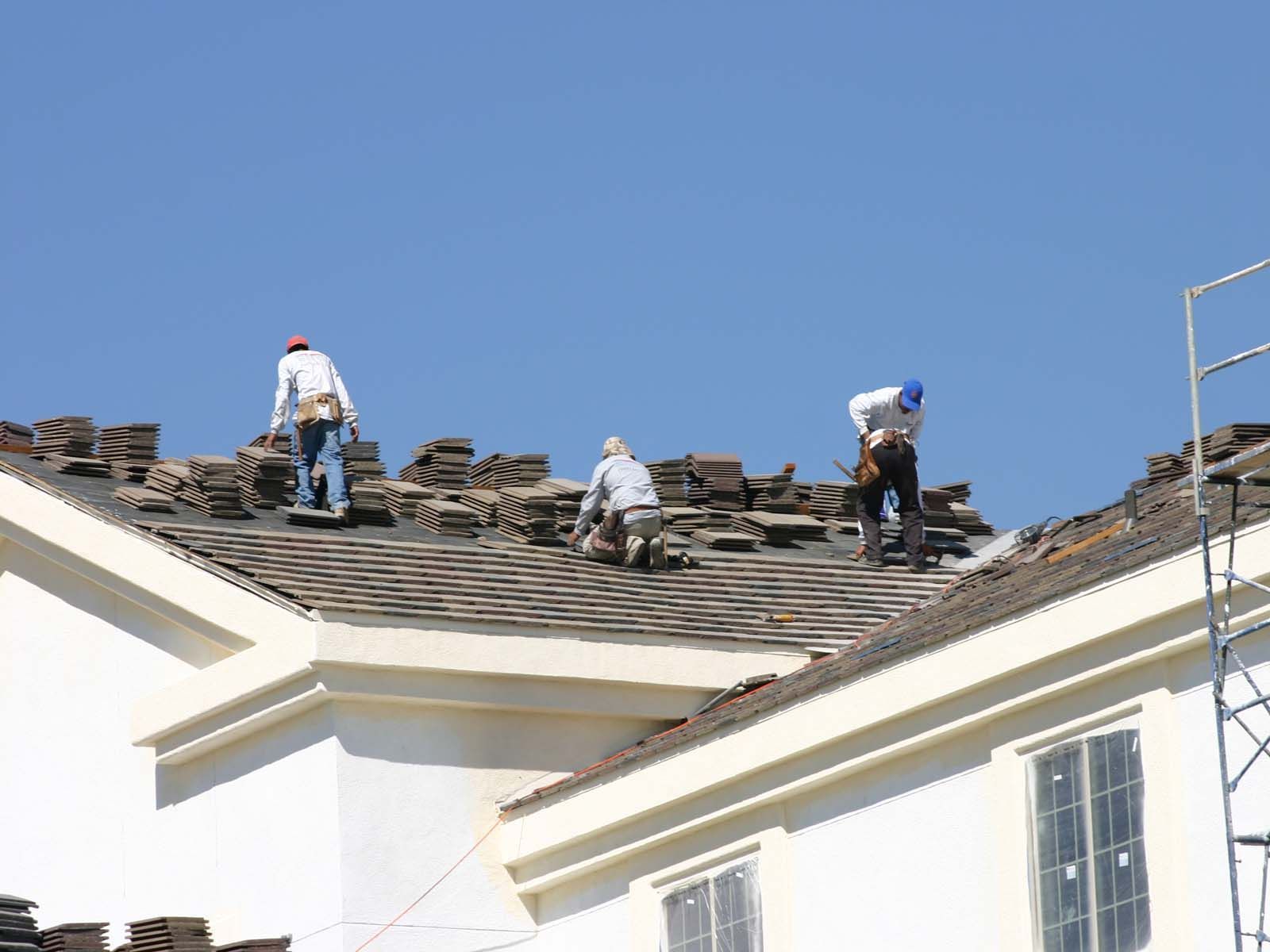 Men Working On Roof — Hubertus, WI — Northwest Roofing, Inc.