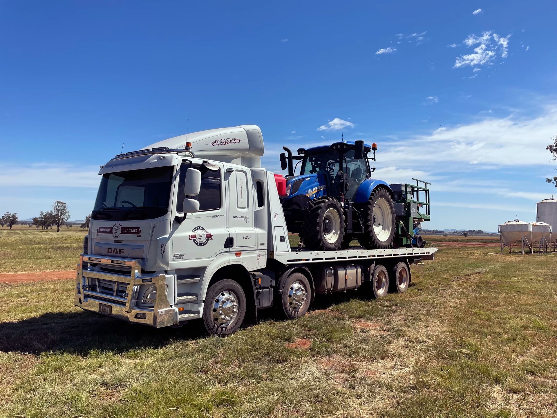 Transportation Of A Mini Tractor By A Tow Truck — Reliable Heavy Machinery in Tamworth, NSW