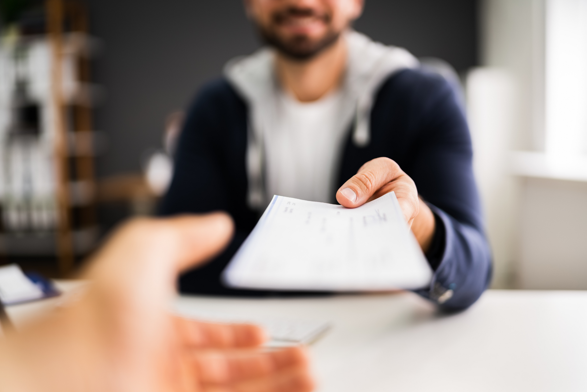 Man Calculating On Calculator Some Expenditures — Blue Chip Bookkeeping In Cranbrook, QLD
