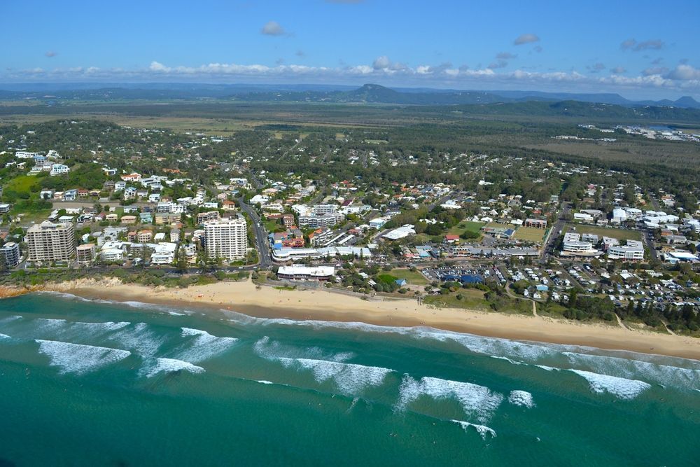 Aerial View of a Coastal Town With a Sandy Beach — Blue Chip Bookkeeping In Sunshine Coast, QLD 