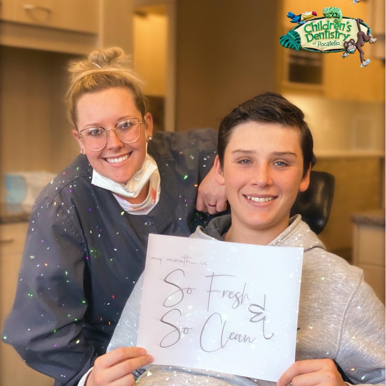 Woman in scrubs and teen smiling, holding 