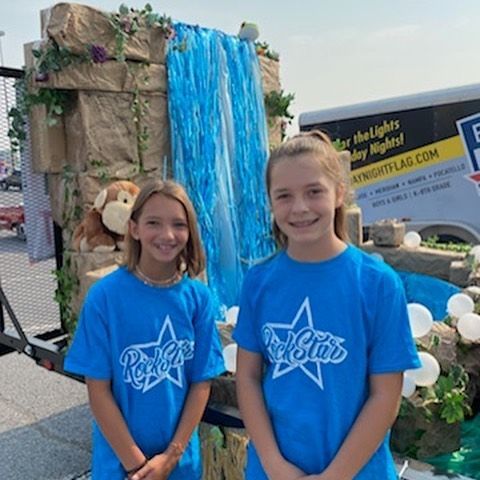 Two girls in matching blue 