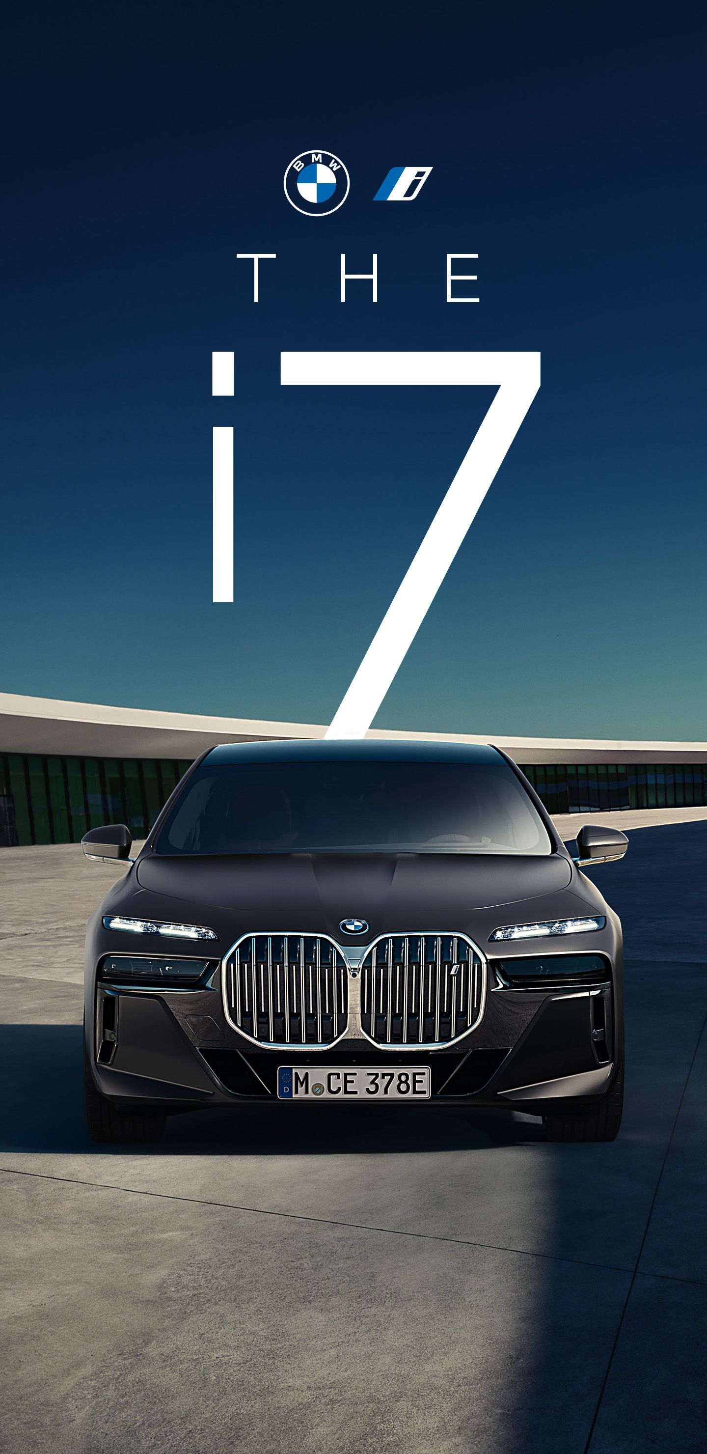 A black BMW i7 car parked on a concrete surface, with the text 