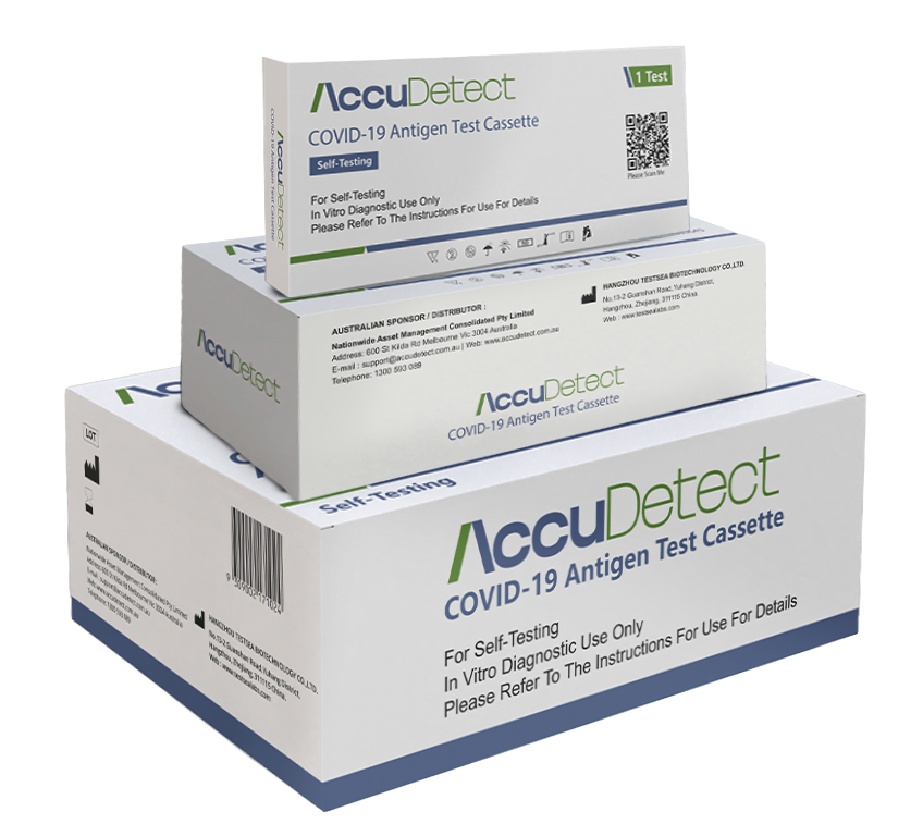 Three boxes of covid-19 test kits are stacked on top of each other.