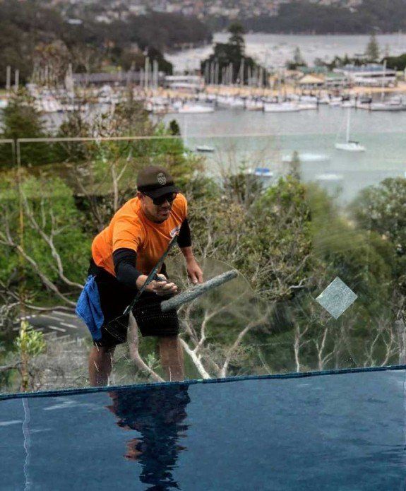 exterior glass wall being cleaned by expert