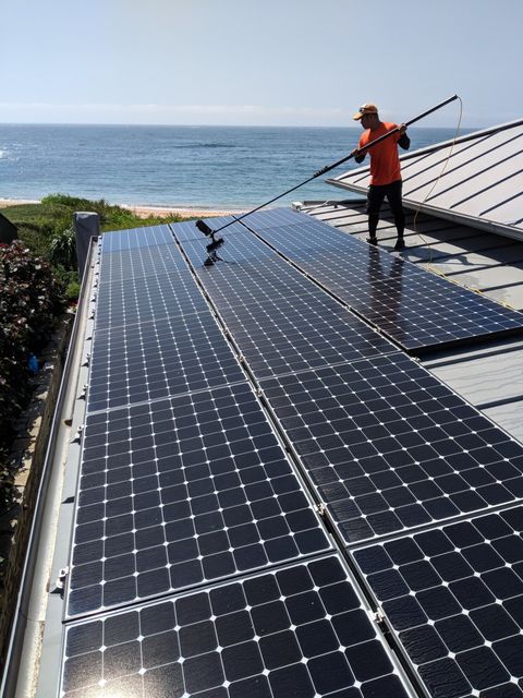 solar panel being cleaned