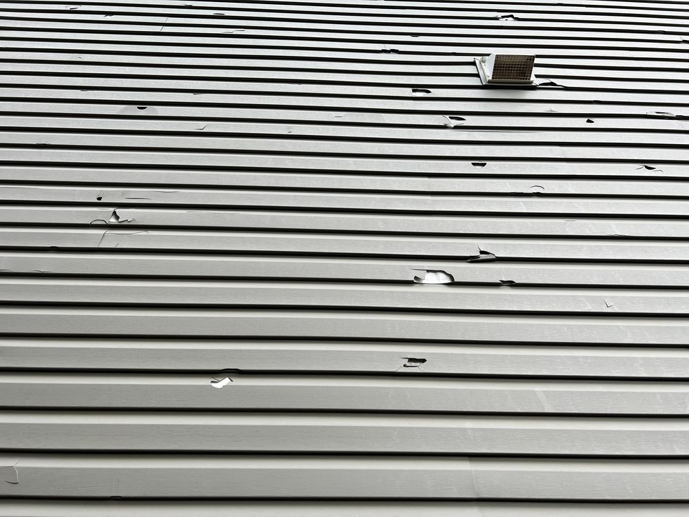 A close up of a roof with holes in it.