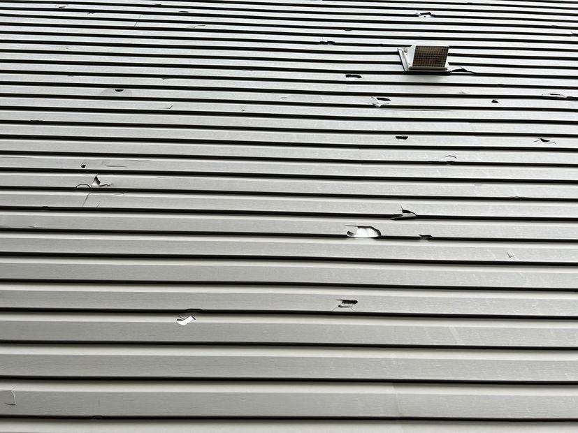 A close up of a roof with holes in it.