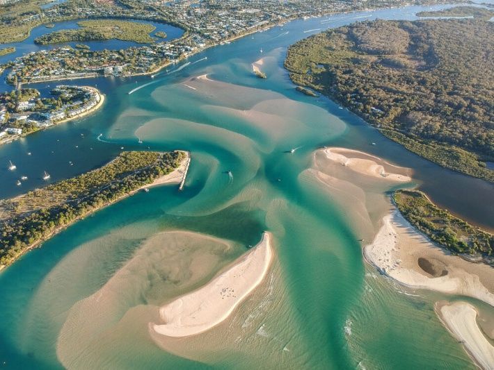 An Aerial View Of A Large Body Of Water Surrounded By Islands — Homemakers Lifestyle In Noosa, QLD