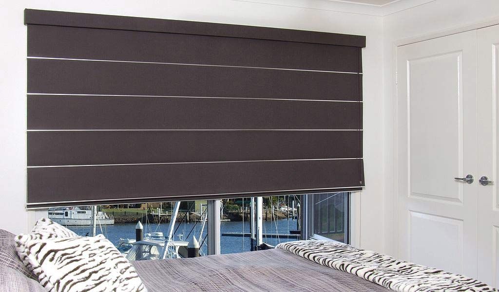 A Bedroom With A Bed And A Window With Blinds On It — Homemakers Lifestyle In Maroochydore, QLD