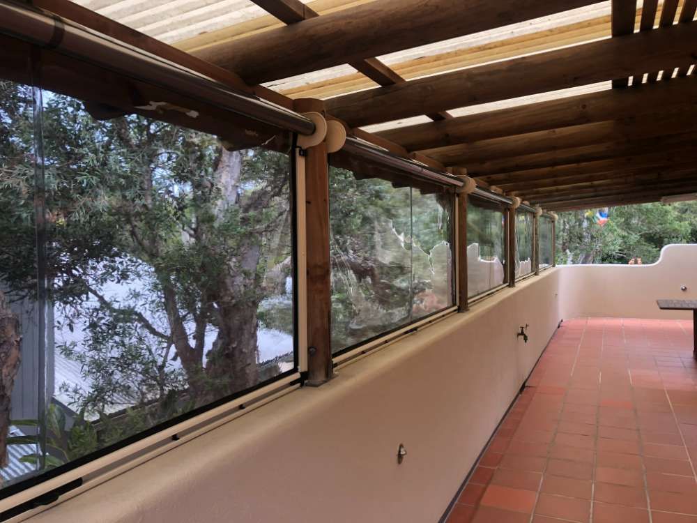 A Long Hallway With Lots Of Windows And Trees — Homemakers Lifestyle In Maroochydore, QLD