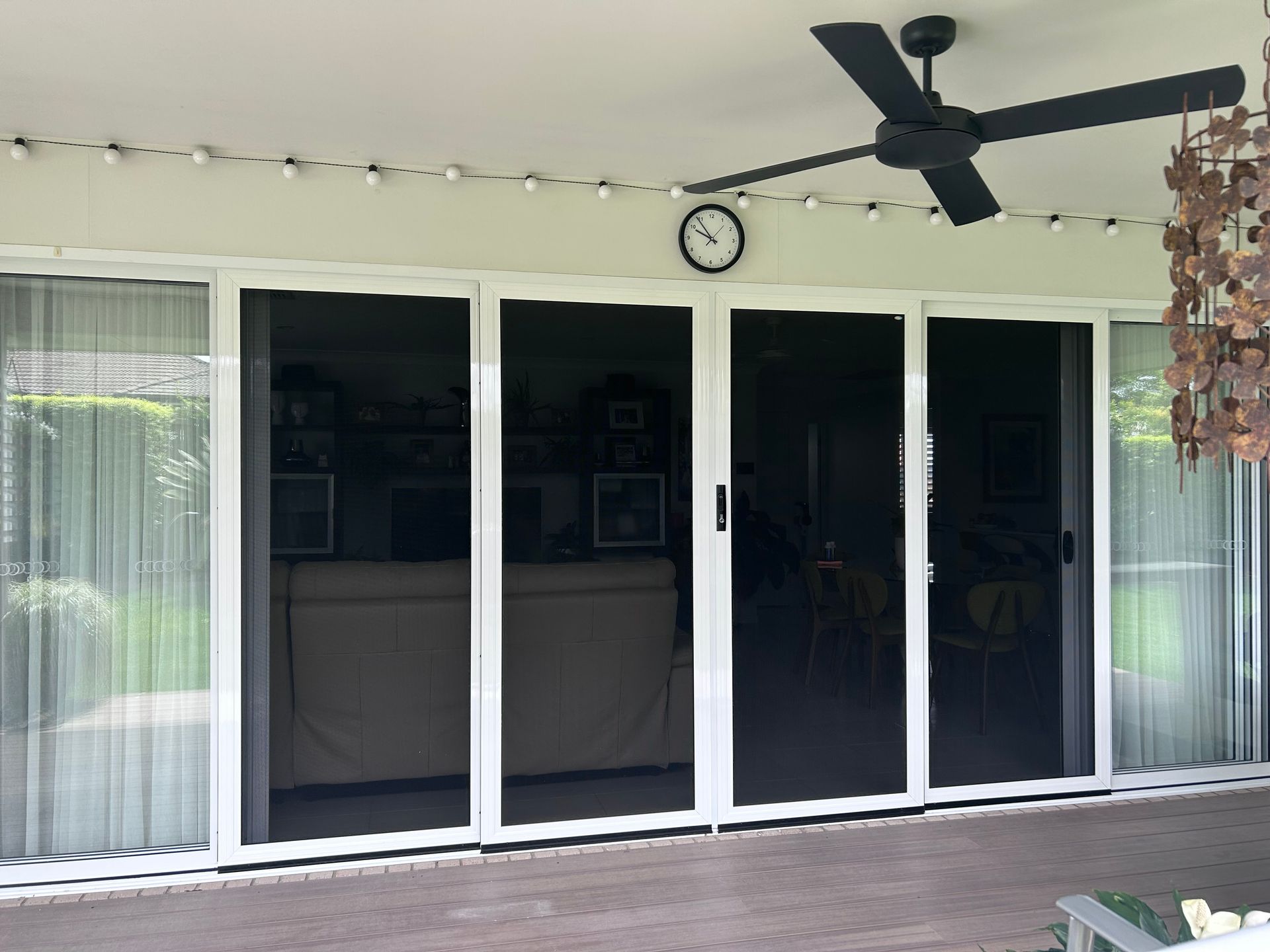 A Sliding Glass Door With A Ceiling Fan Above It — Homemakers Lifestyle In Maroochydore, QLD