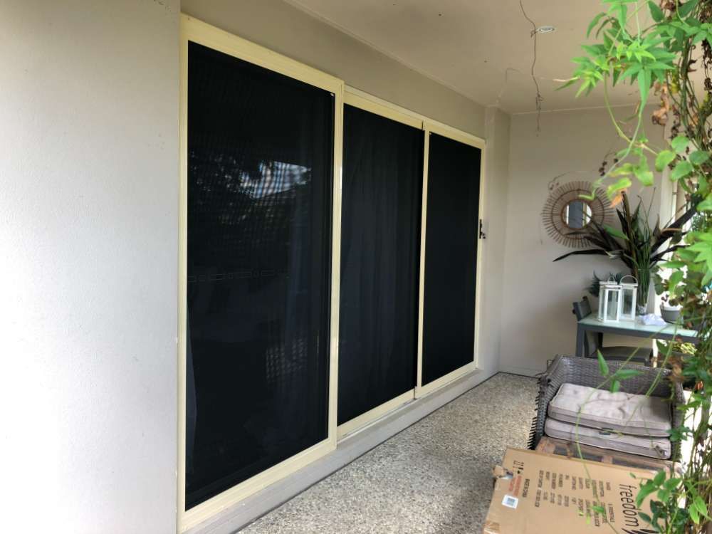 A Patio With Sliding Glass Doors And A Cardboard Box — Homemakers Lifestyle In Maroochydore, QLD