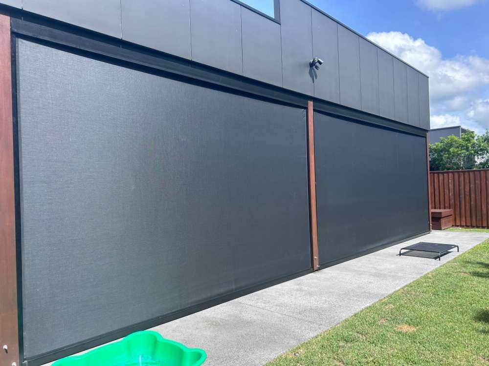 A House With A Large Screen On The Side Of It — Homemakers Lifestyle In Maroochydore, QLD