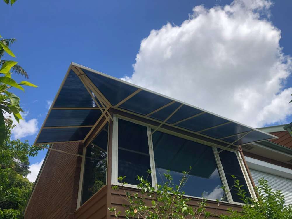 A House With A Large Window And A Canopy On The Roof — Homemakers Lifestyle In Maroochydore, QLD