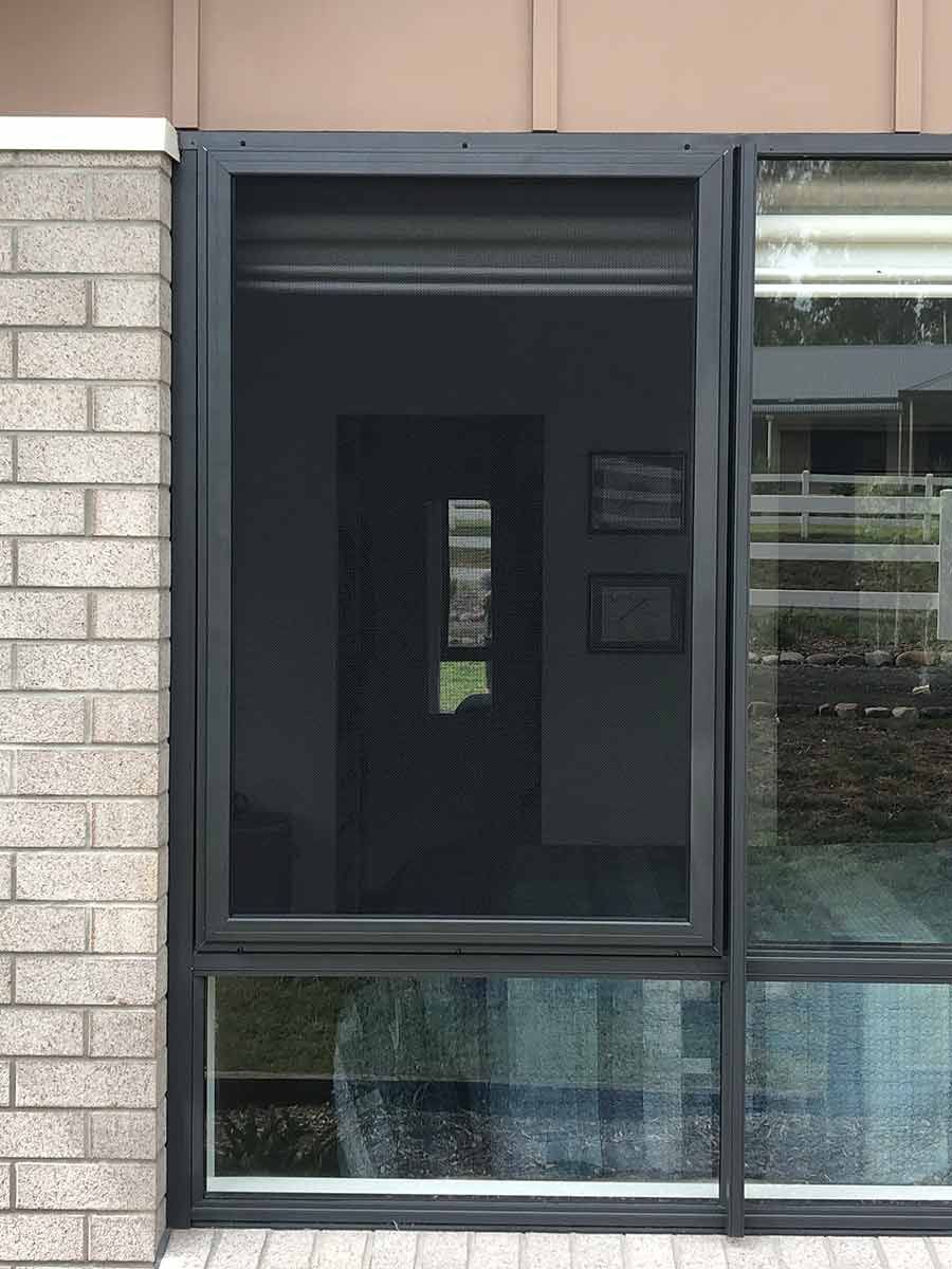 A Large Window With A Screen On It Is On A Brick Building — Homemakers Lifestyle In Maroochydore, QLD