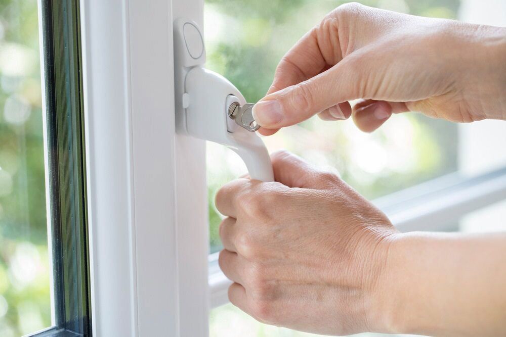 A Person Is Opening A Window With A Key — Homemakers Lifestyle In Caloundra, QLD