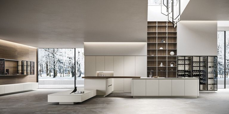 Una cucina moderna con mobili bianchi e ripiani in legno.