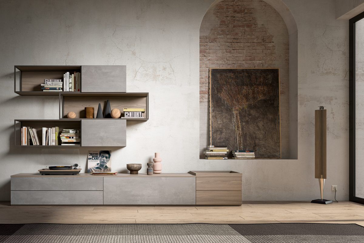 Un soggiorno con un muro di mattoni, un quadro sul muro e una mensola.