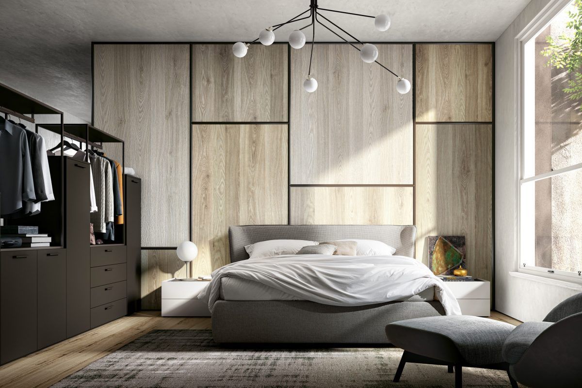 Una camera da letto con un letto, una sedia e un armadio.