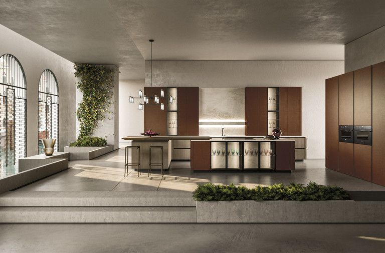 Una cucina con una grande isola al centro della stanza.