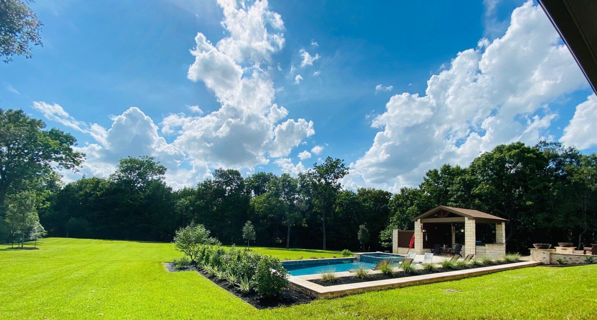 backyard outdoor kitchen and pool