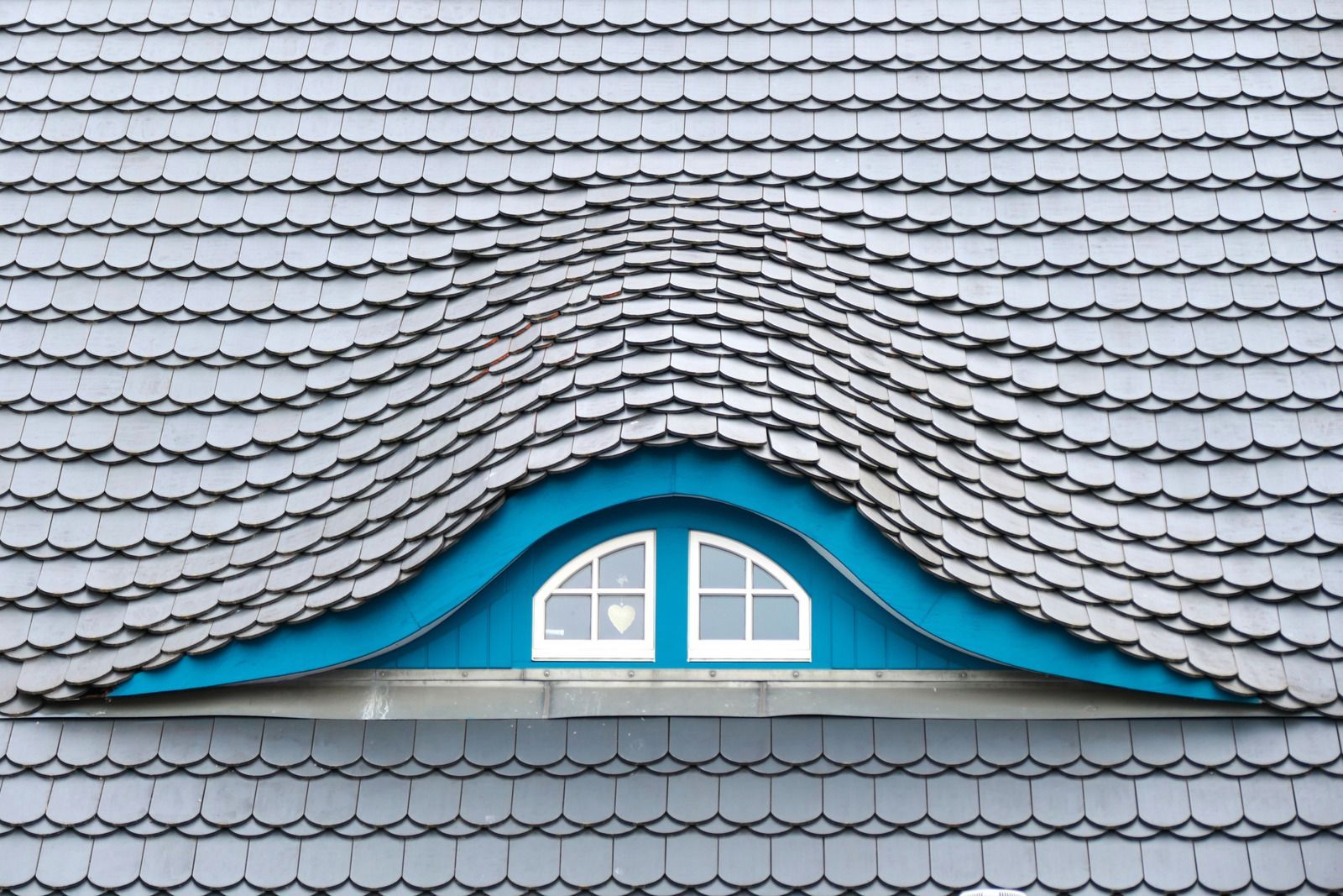 A wooden fence with a gate attached to it.