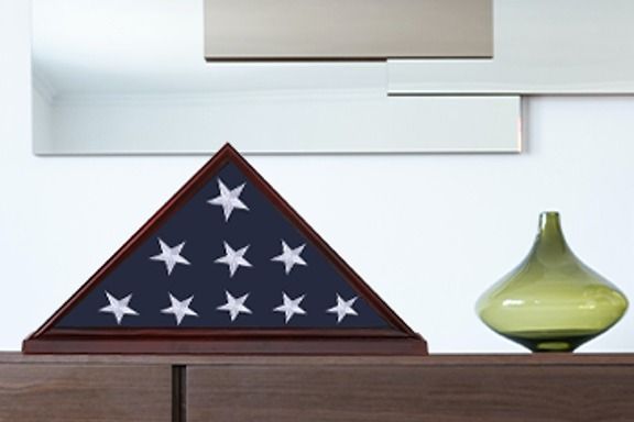 American flag in wood case sitting on table