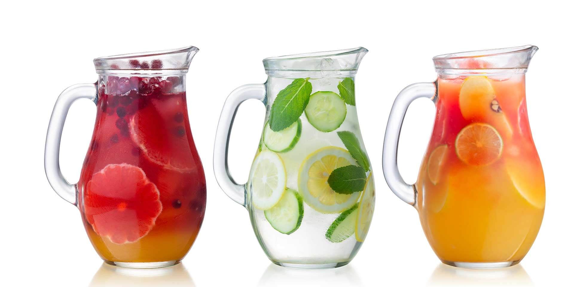 A photo of the glass pitchers filled with beverages