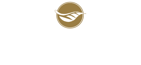 A logo for a company with a leaf in a circle on a white background.