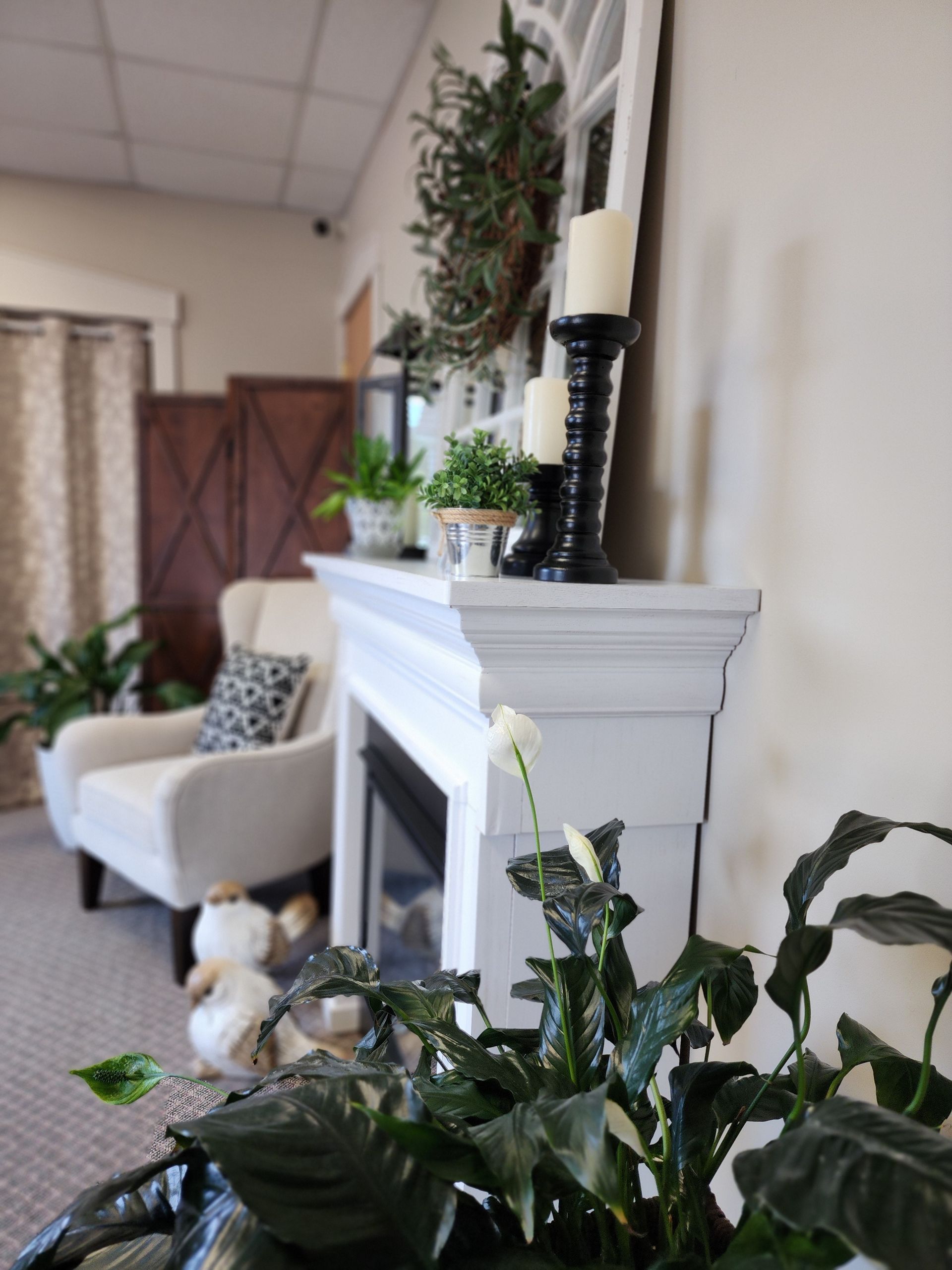 A picture of a fireplace and side chair.