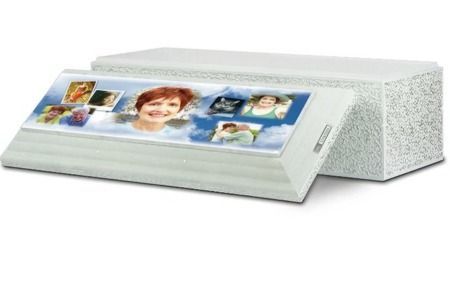 A photo of a burial vault with photos on lid