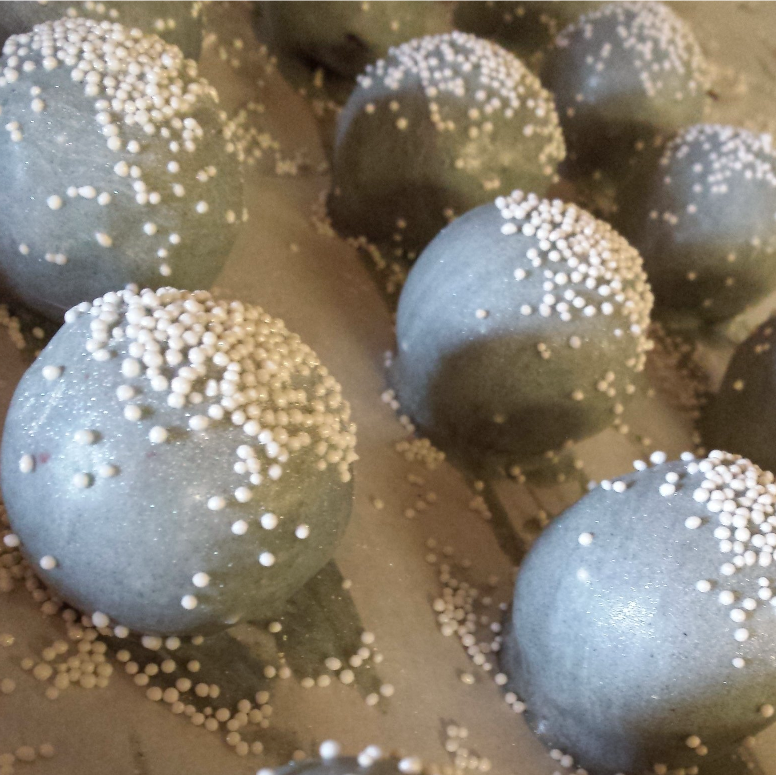Cake balls coated with silver and white decoration
