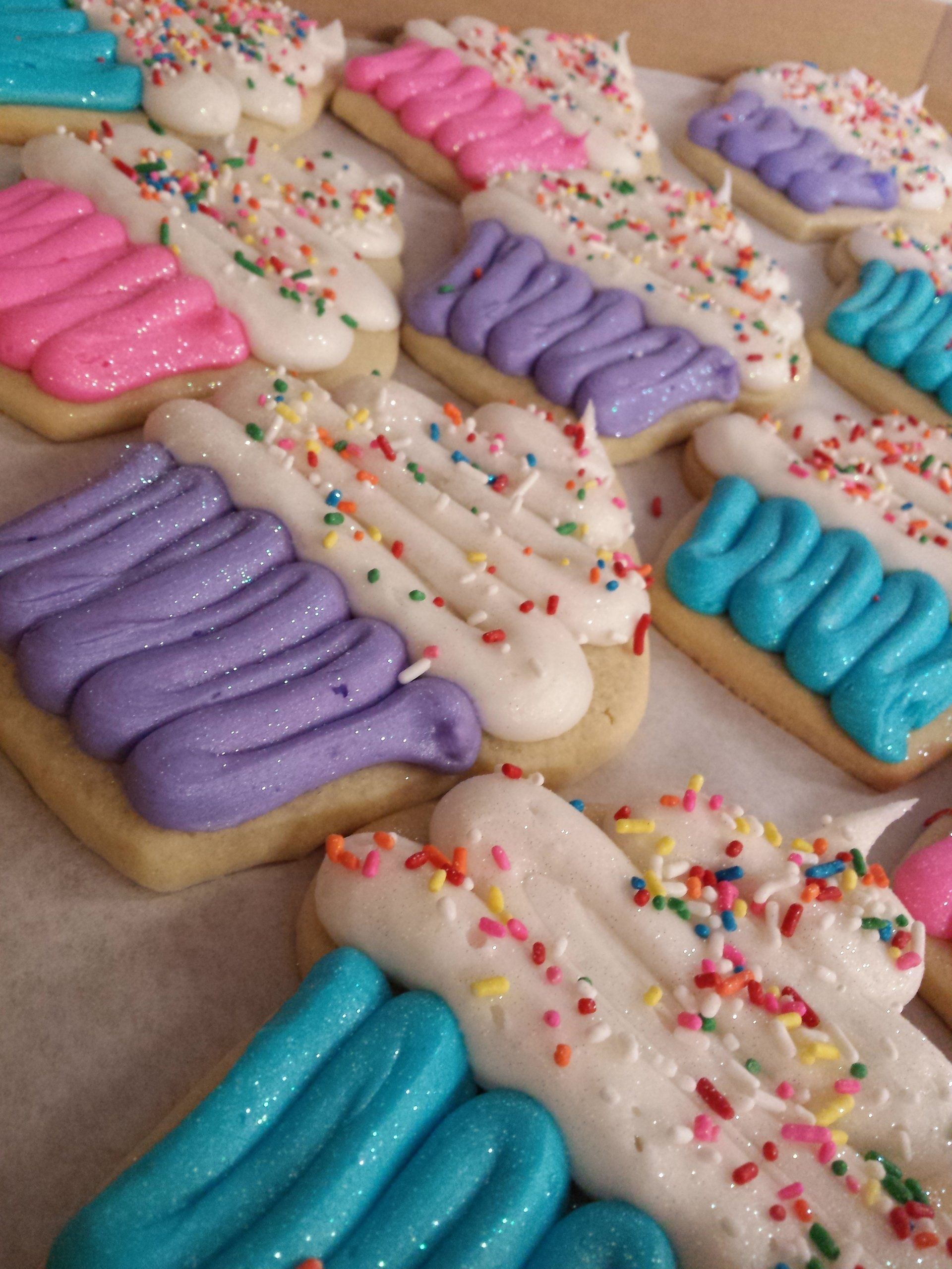 Sugar cookies iced to look like cupcakes with sprinkles