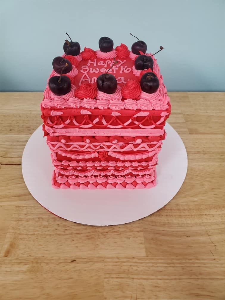 ornate pink cube shaped cake