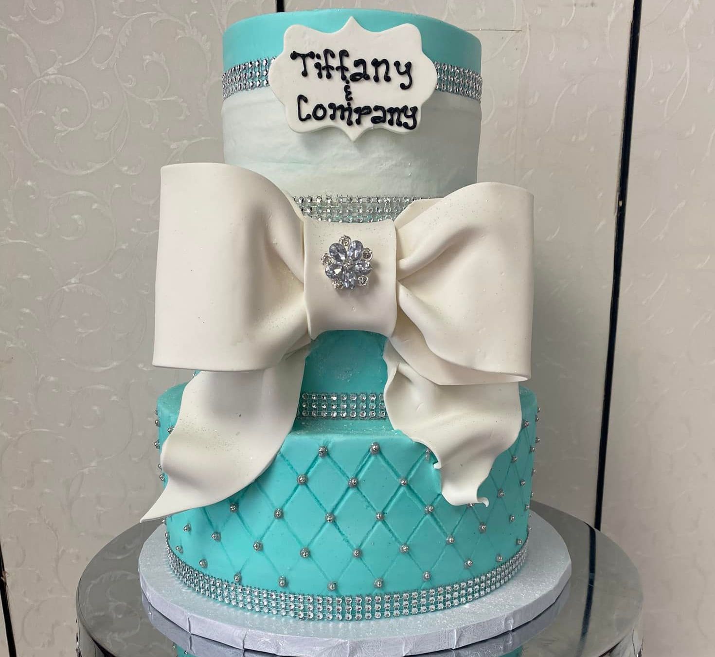 A beautiful Tiffany blue tiered cake with a huge fondant bow
