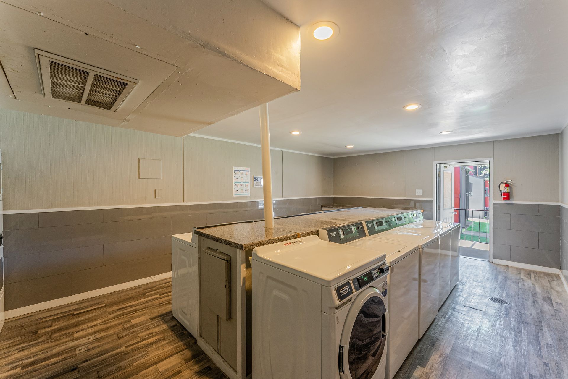 A laundry room with a washer and dryer in it.