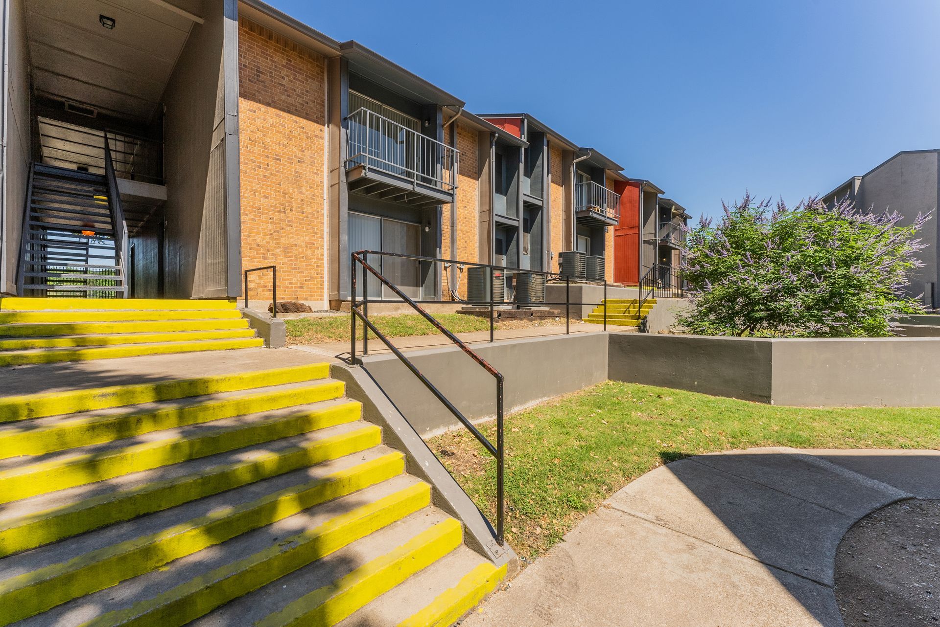 A building with yellow stairs leading up to it.