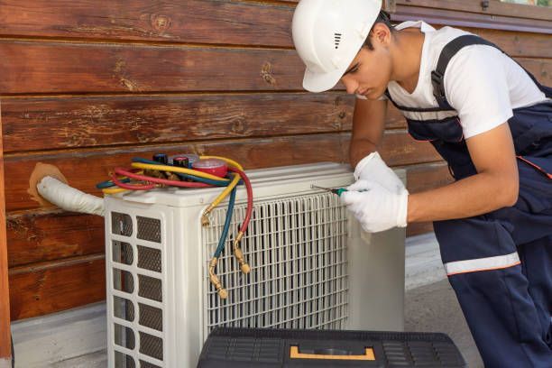 A person fixing a air conditioner | Cool Air Conditioning | Home Air Conditioning in Sunshine Coast