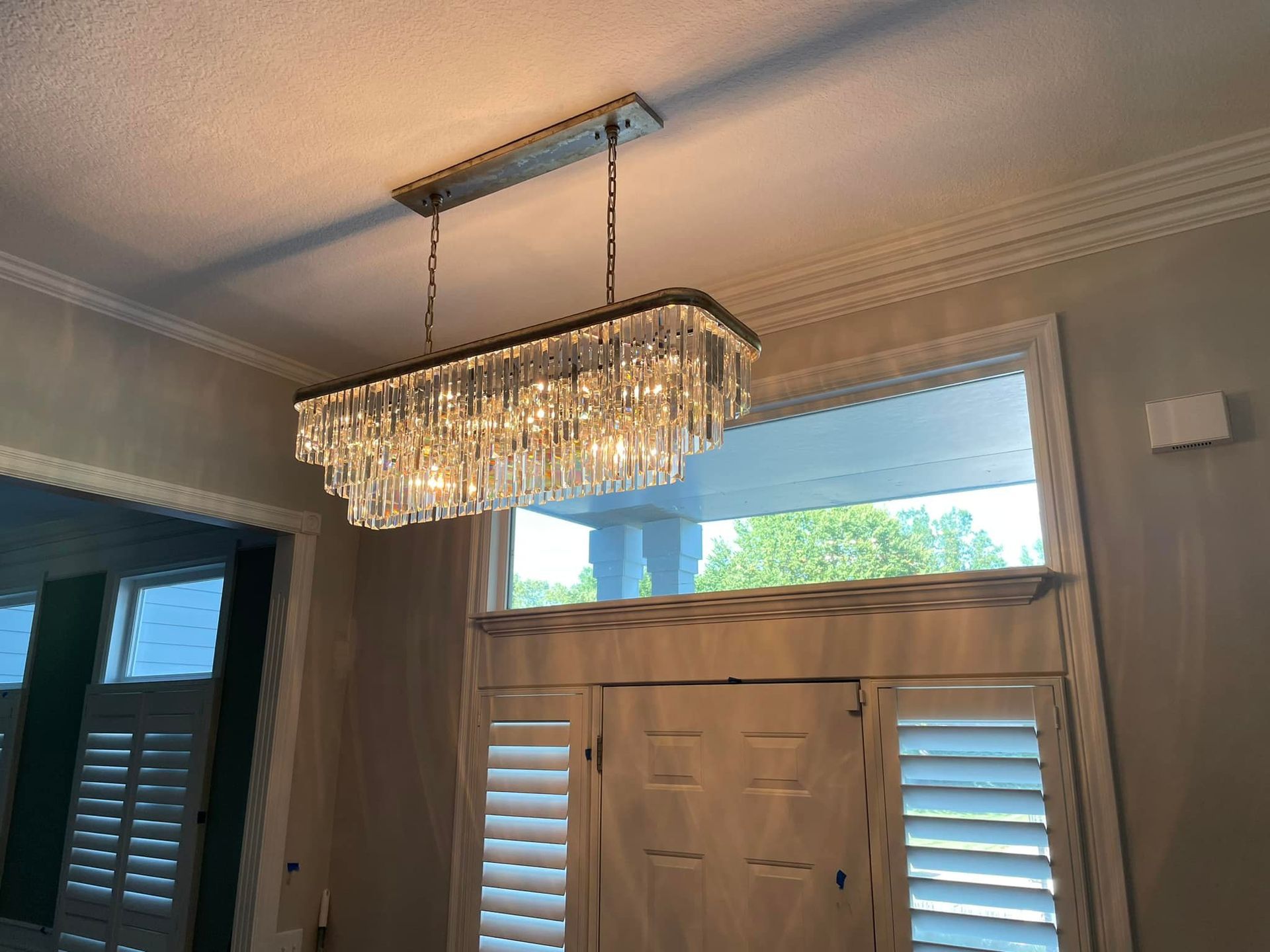 An electrician is working on an electrical box.