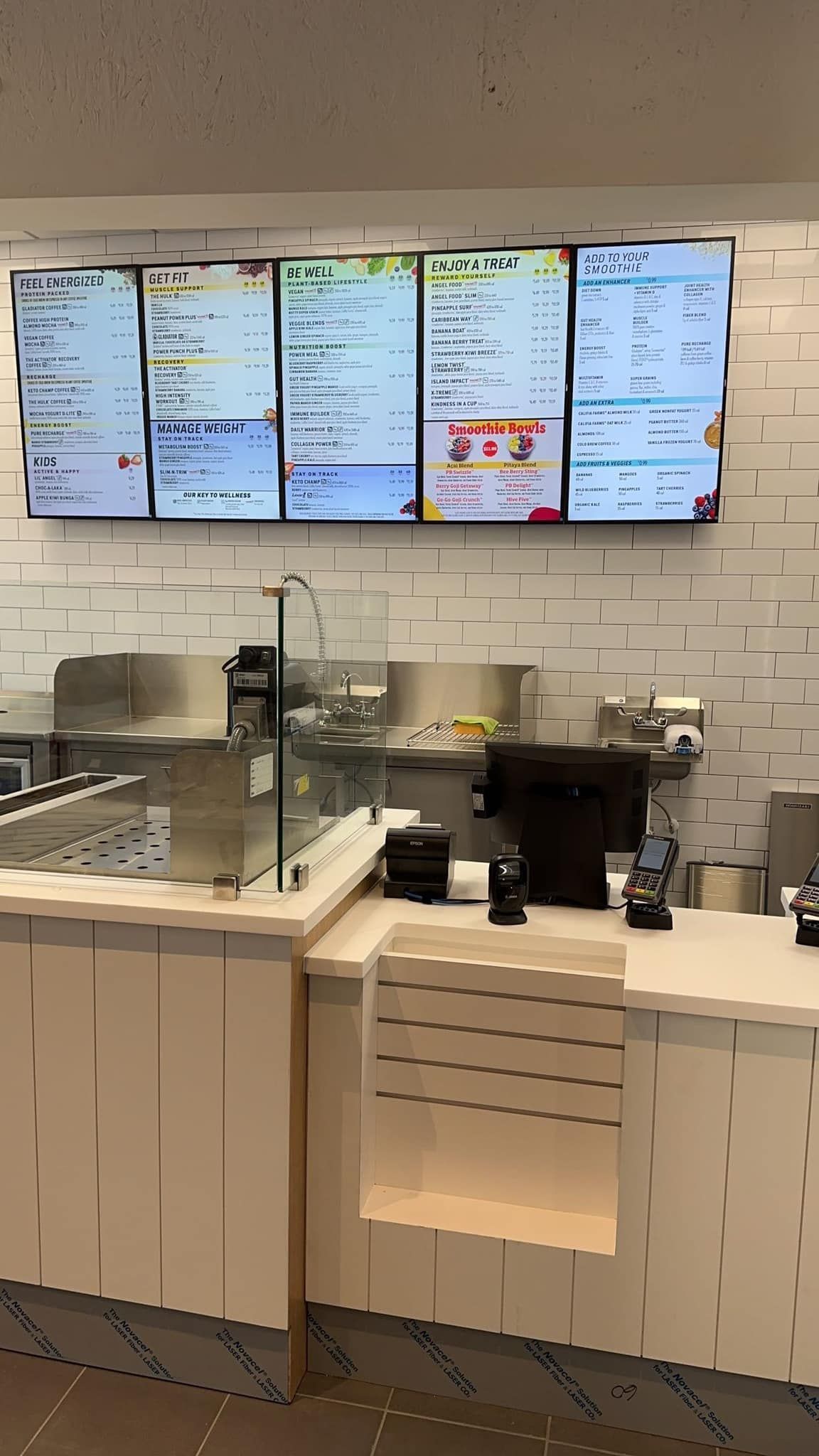 A man is using a tablet to look at a gas meter.