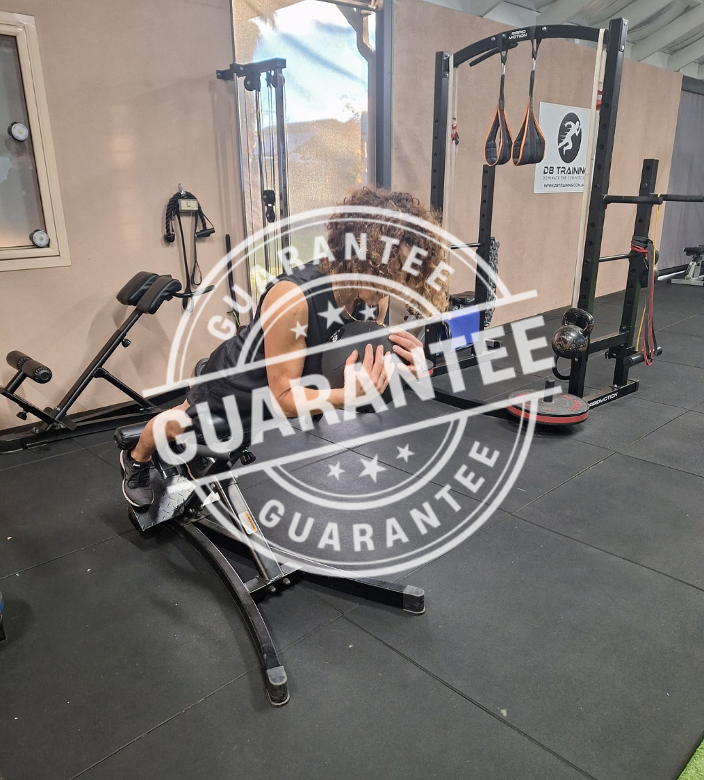 Person exercising on a back extension machine at a gym, with a 