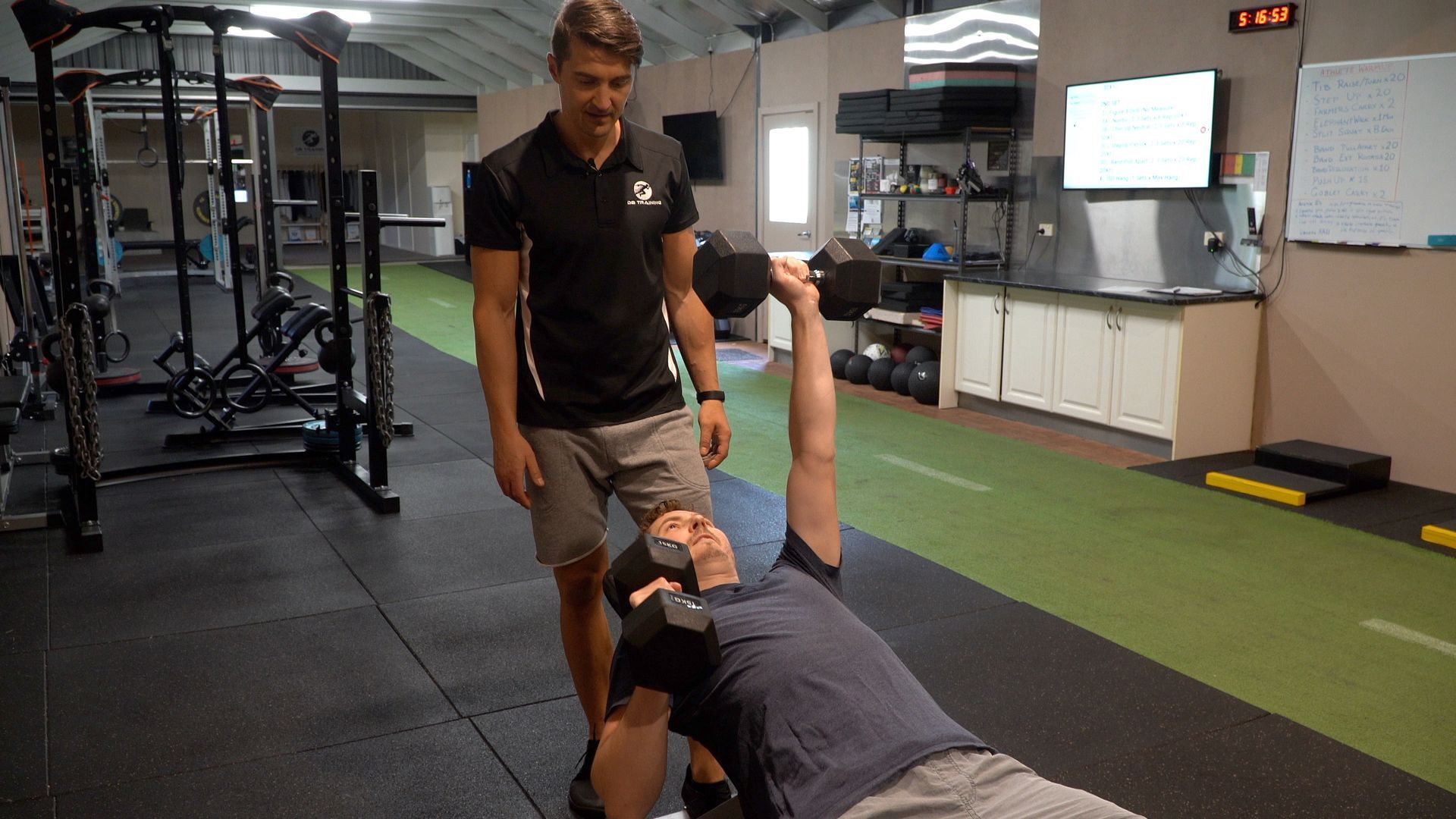 A group of people are doing exercises in a gym.