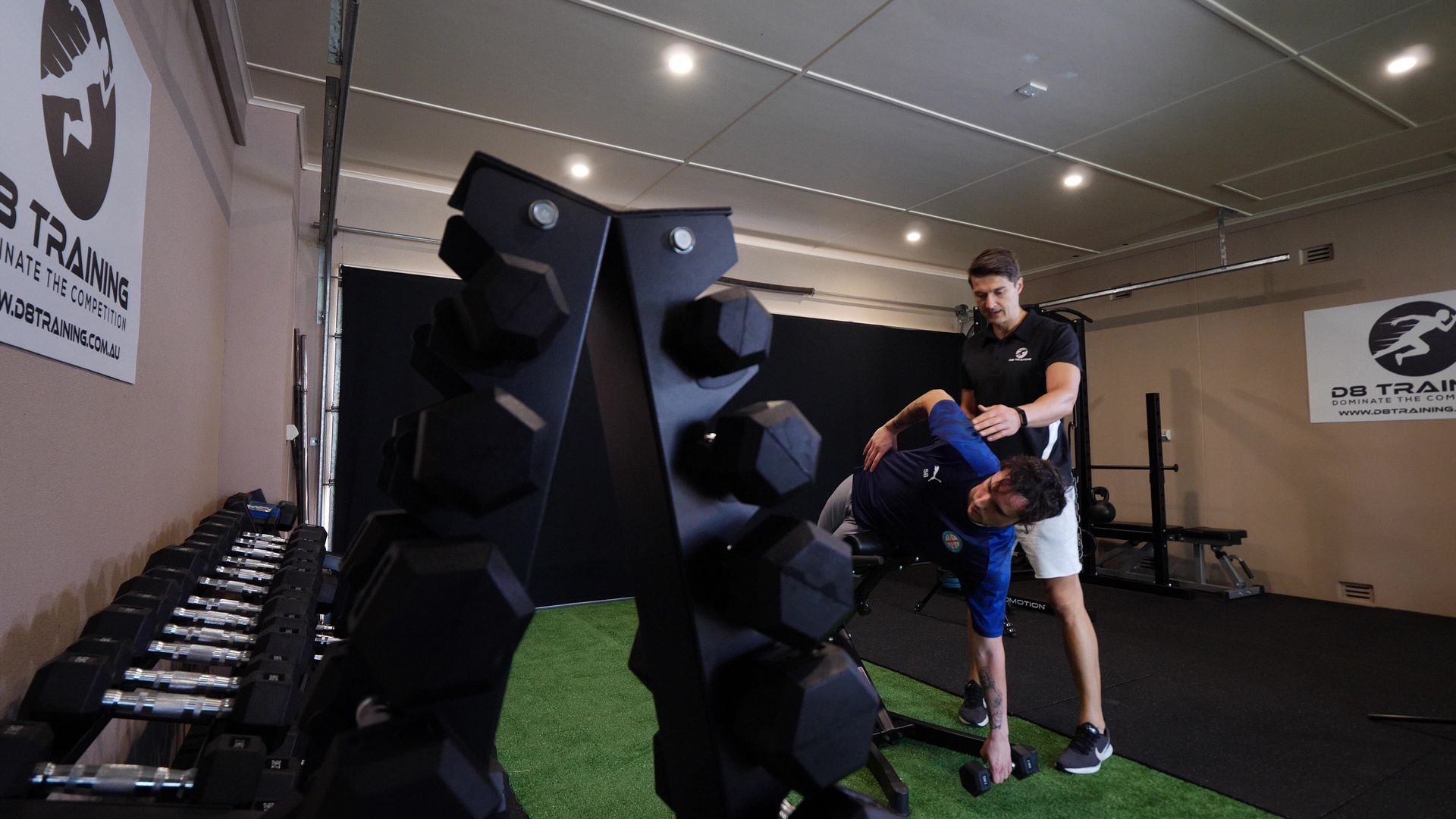 A group of people are working out in a gym.