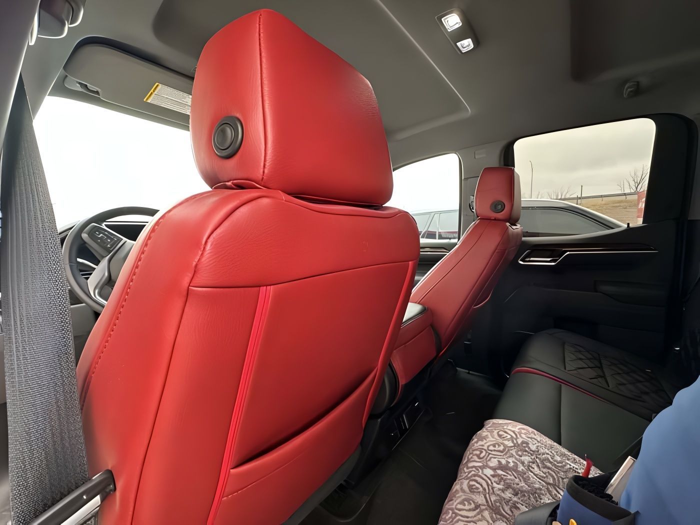 Red leather truck interior with a sunroof.