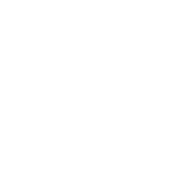 A vertical stack of four vibrant, colorful macaron halves: pink, green, yellow, and orange, on a solid white background.