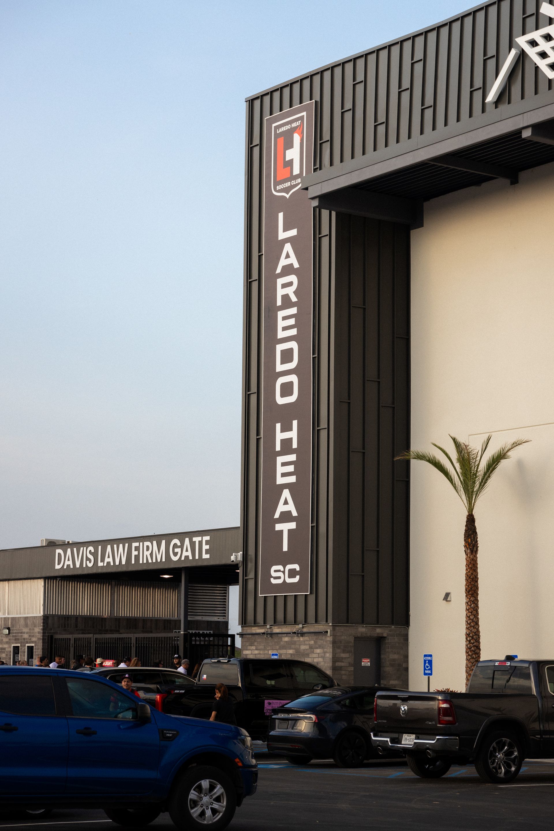 Laredo Heat SC banner next to pegenergy stadium's Davis law firm gate. 
