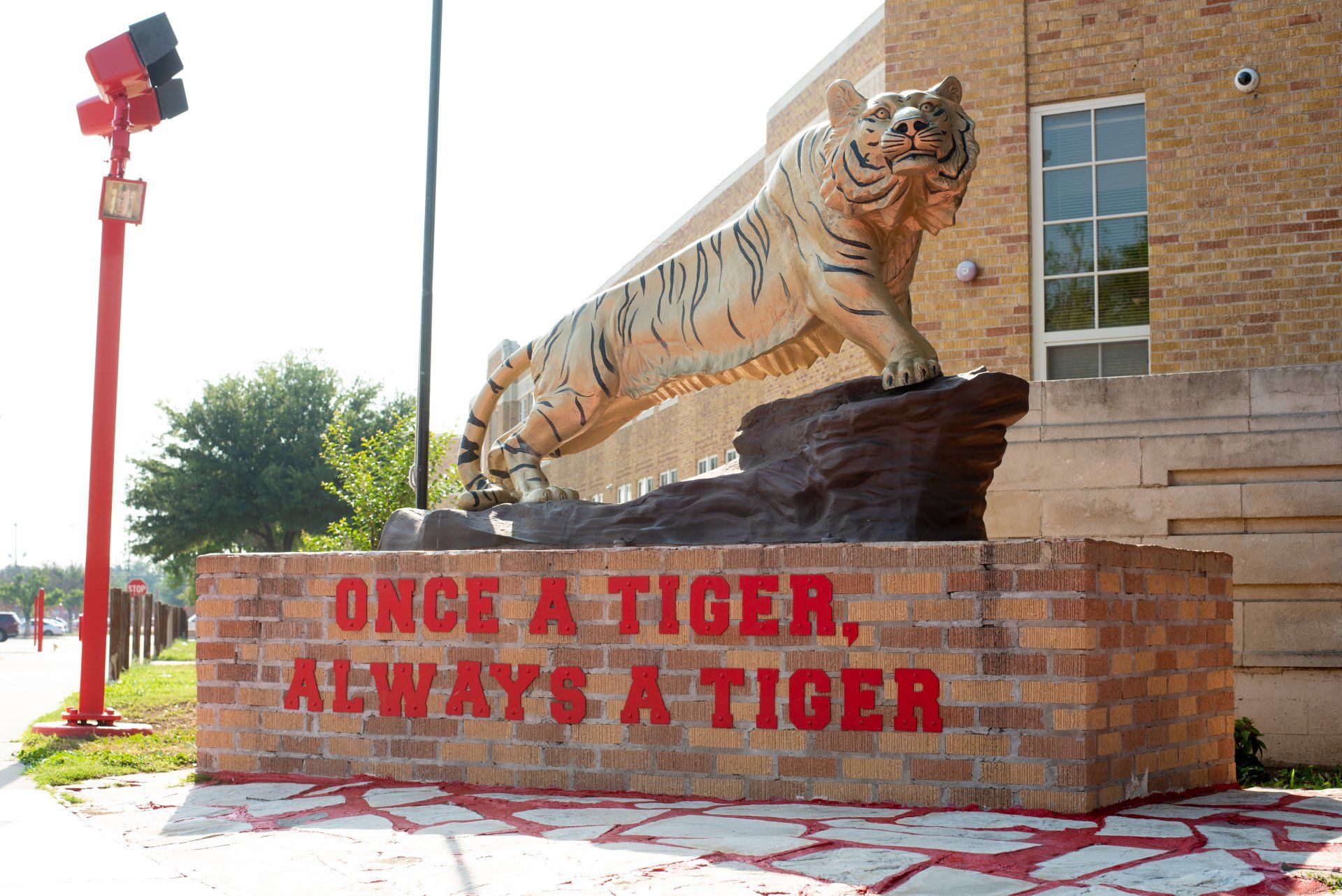A statue of a tiger with the text