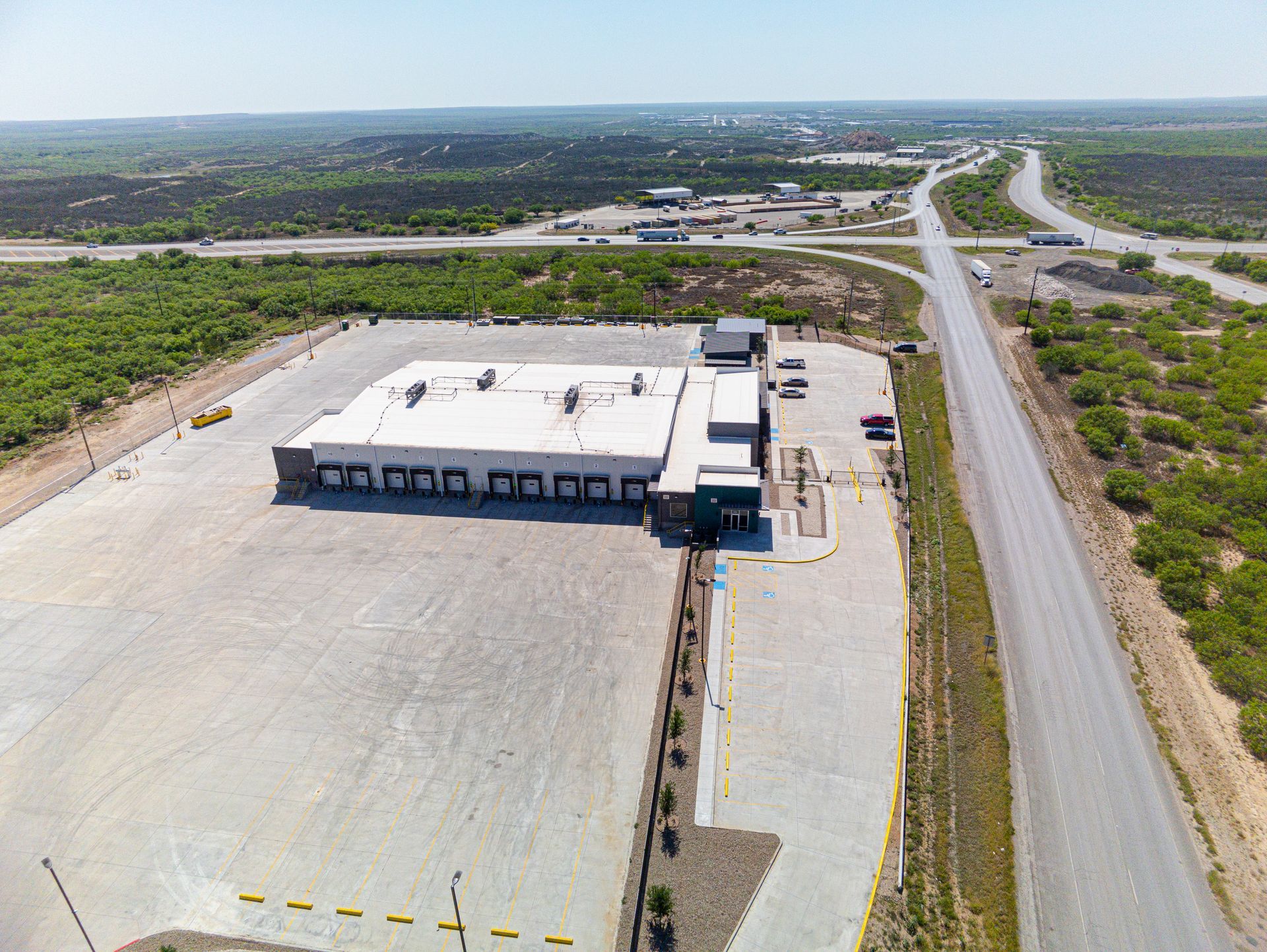 An aerial shot of the side of Garros Services warehouse and the surrounding area. 

