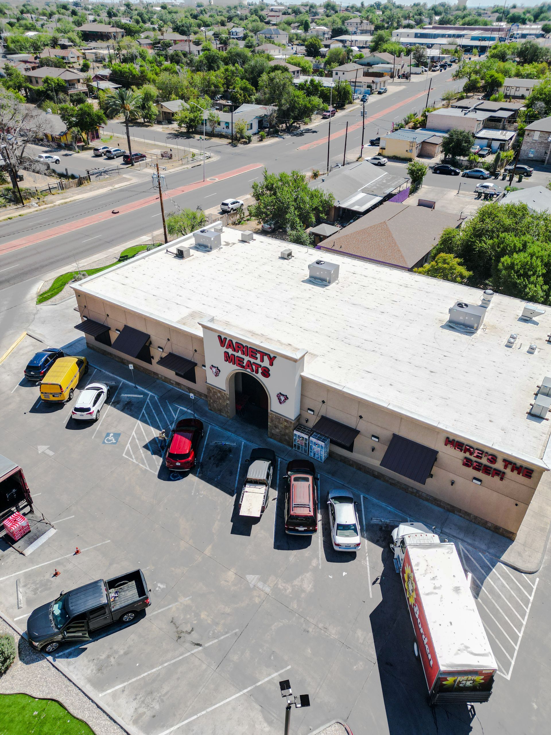 An aerial shot of Variety Meats, located in Laredo, Texas. The parking lot in front of the store can also be seen. 
